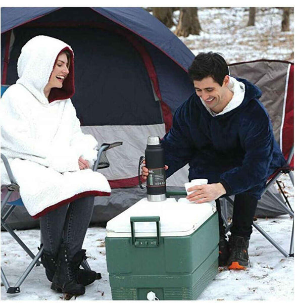 Couple in Blue and Red Snuggie Sherpa fleece outdoor camping in the snow drinking hot tea