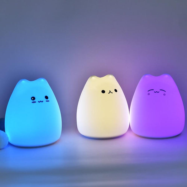Little mini LED cute adorable cat light table lamp colorful three different colors with a white background